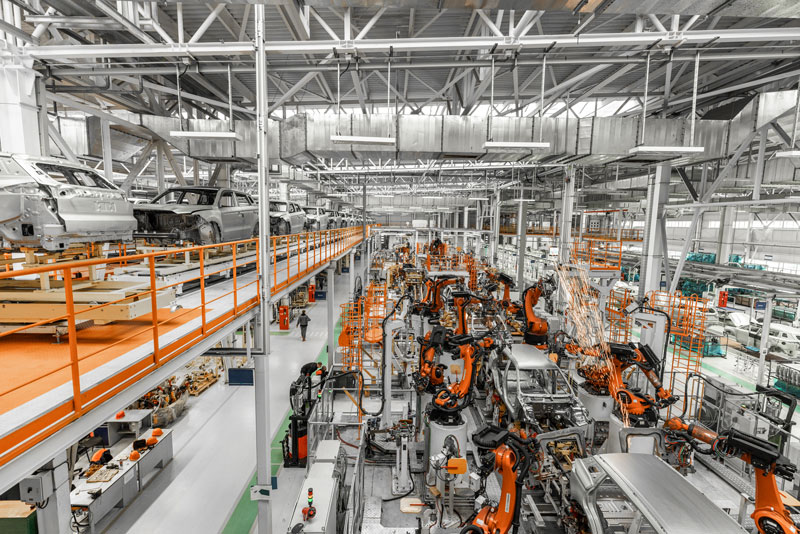 Engineer reviewing data on smart manufacturing technology dashboard